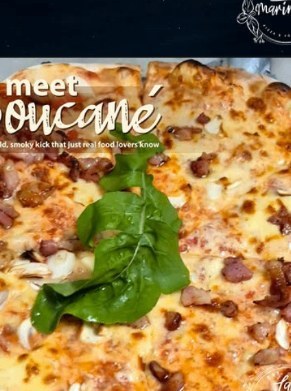 Pizza with fresh spinach leaves and melted cheese