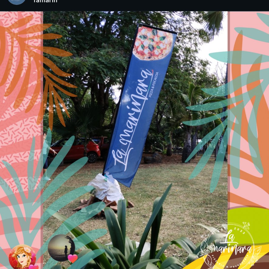 The La Marinara flag flying in the tropical garden in Grand Baie (Mauritius)