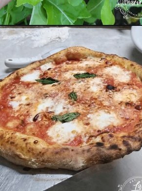 White pizza finished with raw Italian extra virgin olive oil