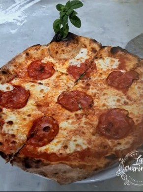 Neapolitan pizza with spicy salami, leopard-spotted crust